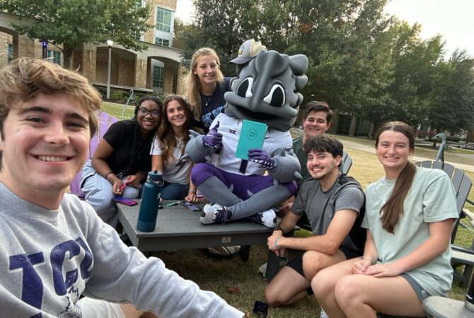 Frog Aides students gathered for a photo with Superfrog